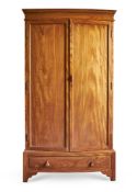 A COTSWOLD SCHOOL SATINWOOD WARDROBE, ATTRIBUTED TO PETER WAALS, CIRCA 1920