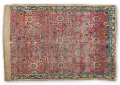 AN EAST CAUCASIAN FRAGMENTARY CARPET OF 'HARSHANG' OR 'BLOSSOM' DESIGN, 17TH/18TH CENTURY