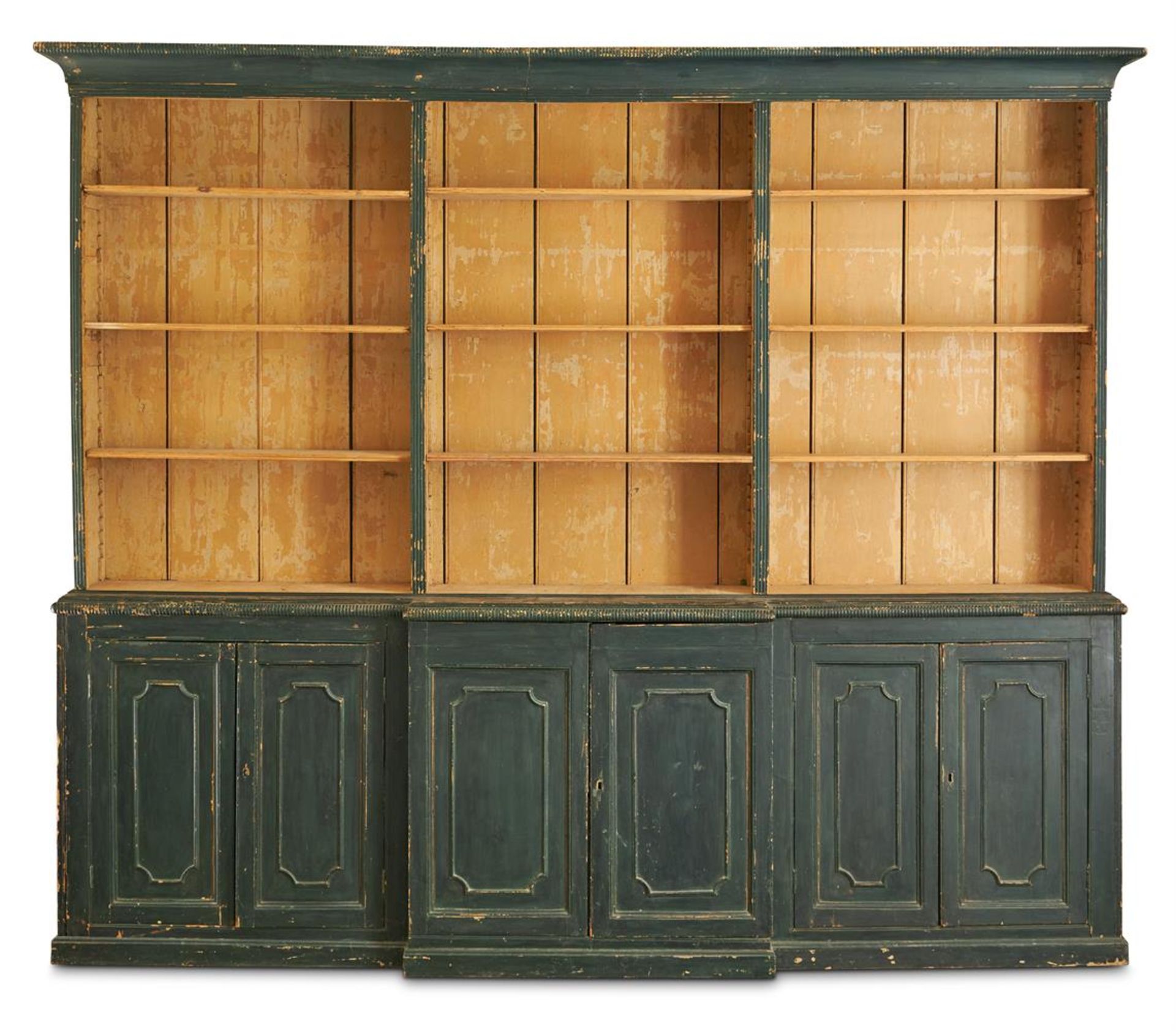 A GEORGE III INDIGO GREEN PAINTED PINE BREAKFRONT BOOKCASE, EARLY 19TH CENTURY