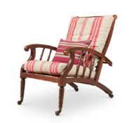 AN ARTS AND CRAFTS OAK RECLINING ARMCHAIR IN THE MANNER OF PHILIP WEBB, LATE 19TH CENTURY