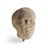 A ROMAN OR LATER LIMESTONE HEAD OF A MAN