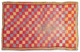 A TIBETAN CHEQUERBOARD RUG, CIRCA 1900