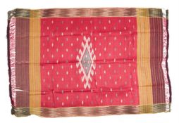 A SILK FRINGED RECTANGULAR IKAT PANEL, PROBABLY SOUTH EAST ASIAN, LATE 19TH/EARLY 20TH CENTURY