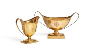 A GILDED METAL CREAM JUG AND TWIN HANDLED SUGAR BOWL, POSSIBLY LATE 18TH/EARLY 19TH CENTURY