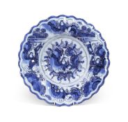 A FRANKFURT FAIENCE TRANSITIONAL STYLE DISH WITH FLUTED EDGEEARLY 18TH CENTURY35cm diameter