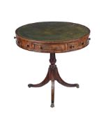 A MAHOGANY DRUM TABLE IN REGENCY STYLE