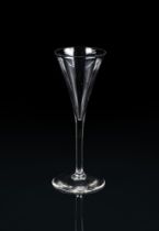 A PLAIN-STEMMED TOASTING GLASS