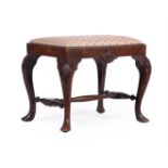 A CARVED MAHOGANY STOOL IN GEORGE II IRISH STYLE