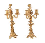 A PAIR OF FRENCH ORMOLU AND GILT METAL CANDLESTICKS
