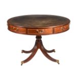 A MAHOGANY DRUM TOP LIBRARY TABLE IN REGENCY STYLE