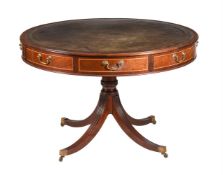 A MAHOGANY DRUM TOP LIBRARY TABLE IN REGENCY STYLE
