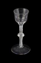 A CENTRALLY-KNOPPED OPAQUE TWIST WINE GLASS