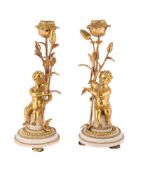 A PAIR OF FRENCH ORMOLU AND WHITE MARBLE CANDLESTICKS