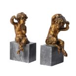 A PAIR OF FRENCH GILT BRONZE AND MARBLE BACCHANALIAN BOOKENDS