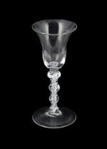 A MULTI-KNOPPED OPAQUE TWIST WINE GLASS