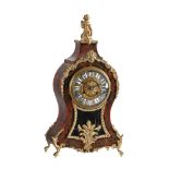 Y A FRENCH RED TORTOISESHELL, BRASS INLAID, AND GILT METAL MOUNTED MANTEL CLOCK