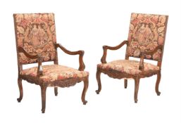 A PAIR OF FRENCH WALNUT AND NEEDLEWORK UPHOLSTERED CHAIRS IN EARLY 18TH CENTURY TASTE