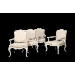 A SET OF FOUR WHITE PAINTED SALON ARMCHAIRS IN FRENCH TASTE