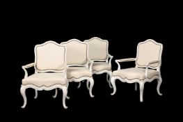 A SET OF FOUR WHITE PAINTED SALON ARMCHAIRS IN FRENCH TASTE
