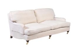 A BEECH AND UPHOLSTERED SOFA