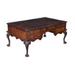 A MAHOGANY PARTNER'S DESK IN GEORGE II STYLE