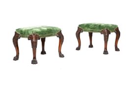 A PAIR OF CARVED MAHOGANY STOOLS IN GEORGE II STYLE
