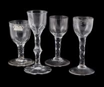 FOUR VARIOUS FACET-STEMMED WINE GLASSES