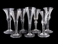 SEVEN VARIOUS PLAIN-STEMMED WINE GLASSES MID 18th CENTURY AND LATERFor the most part Low Countries