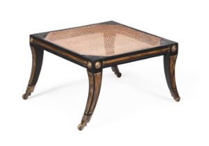 AN EBONISED HARDWOOD AND PARCEL GILT STOOL IN REGENCY STYLE