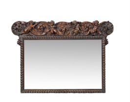 A CONTINENTAL CARVED WALNUT WALL MIRROR, PROBABLY ITALIAN