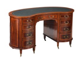 AN EDWARDIAN MAHOGANY AND INLAID KIDNEY' SHAPED WRITING DESK