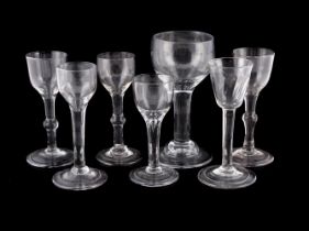 SEVEN VARIOUS PLAIN-STEMMED WINE GLASSES