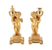 A PAIR OF FRENCH ORMOLU CHERUB CANDLESTICKS OR CASSOLETTES