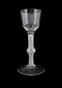 A CENTRALLY-KNOPPED OPAQUE TWIST WINE GLASS