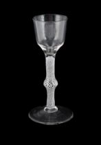 A CENTRALLY-KNOPPED OPAQUE TWIST WINE GLASS