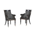 A PAIR OF EBONSIED BERGERE AMRCHAIRS IN GEORGE IV STYLE