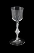 A CENTRALLY-KNOPPED OPAQUE TWIST WINE GLASS