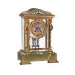 A FRENCH GILT BRASS, GREEN ONYX AND CHAMPLEVE ENAMELLED FOUR-GLASS MANTEL CLOCK