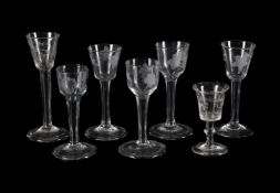 SEVEN VARIOUS ENGRAVED PLAIN-STEMMED WINE GLASSES