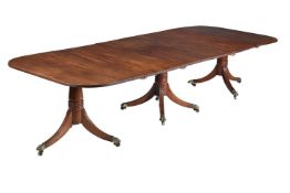 A GEORGE III MAHOGANY TRIPLE PILLAR EXTENDING DINING TABLE