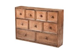 A VICTORIAN PINE CHEST OF NINE DRAWERS