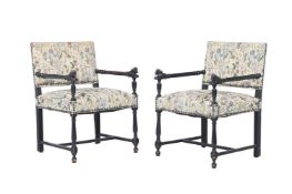 A PAIR OF EBONISED BEECH AND UPHOLSTERED ARMCHAIRS IN LOUIS XIII STYLE