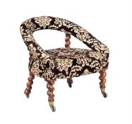 A VICTORIAN WALNUT AND FABRIC UPHOLSTERED ARMCHAIR