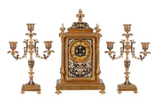 A FRENCH GILT BRASS AND CHAMPLEVE ENAMEL MANTEL CLOCK GARNITURE