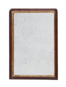 A GEORGE II WALNUT AND PARCEL GILT MIRROR