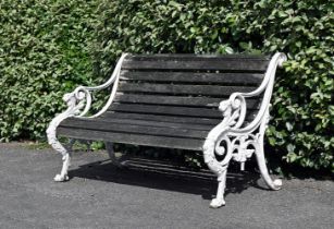 A WHITE PAINTED CAST IRON GARDEN BENCH