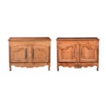 A NEAR PAIR OF FRENCH PROVINCIAL ASH OR ELM BUFFETS