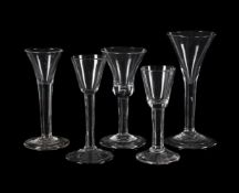 FIVE VARIOUS PLAIN-STEMMED WINE GLASSES
