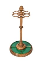 AN OAK AND BRASS MOUNTED CIRCULAR STICK STAND