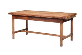 A FRENCH CHESTNUT OR FRUITWOOD EXTENDING DINING TABLE